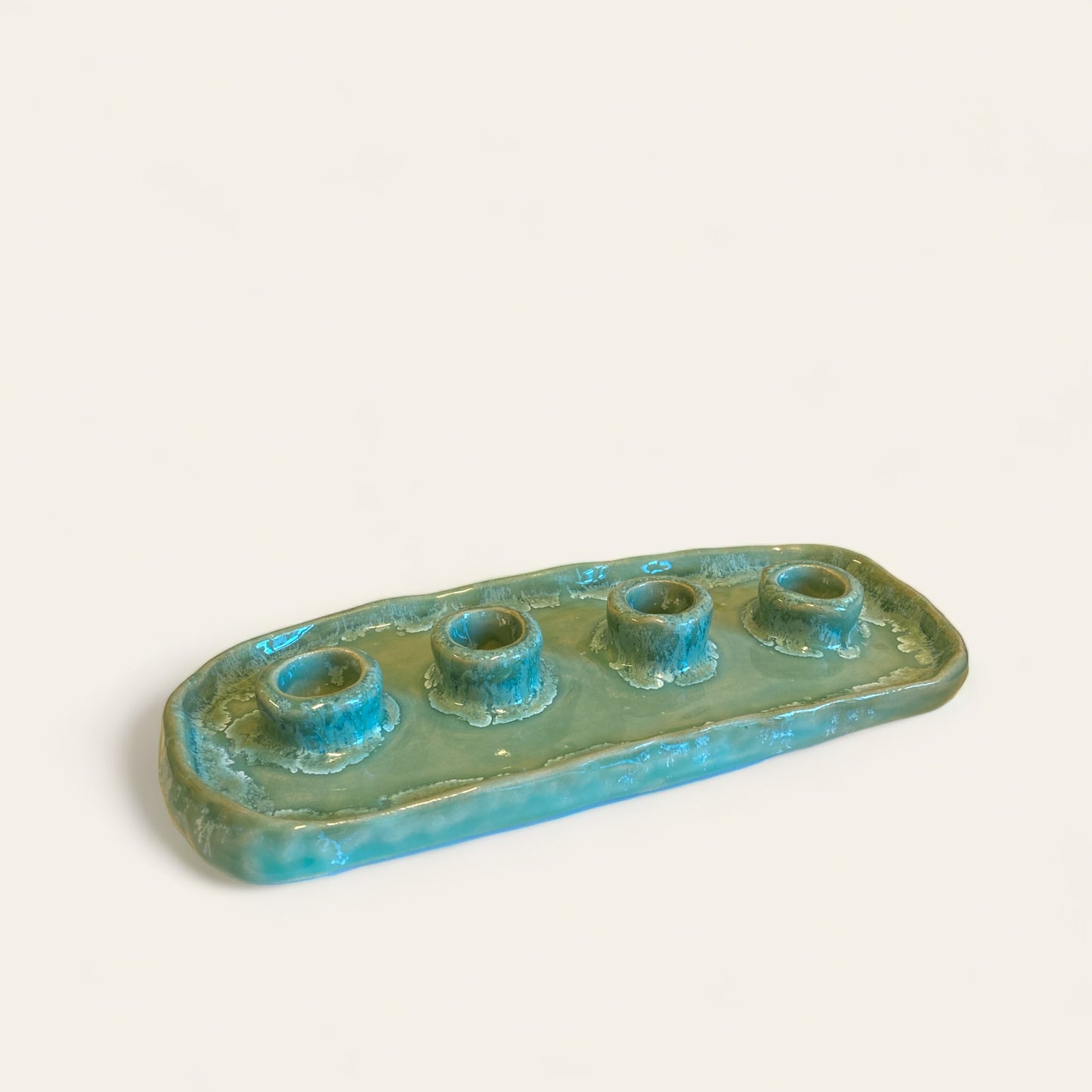 Lysestage med plads til fire lys