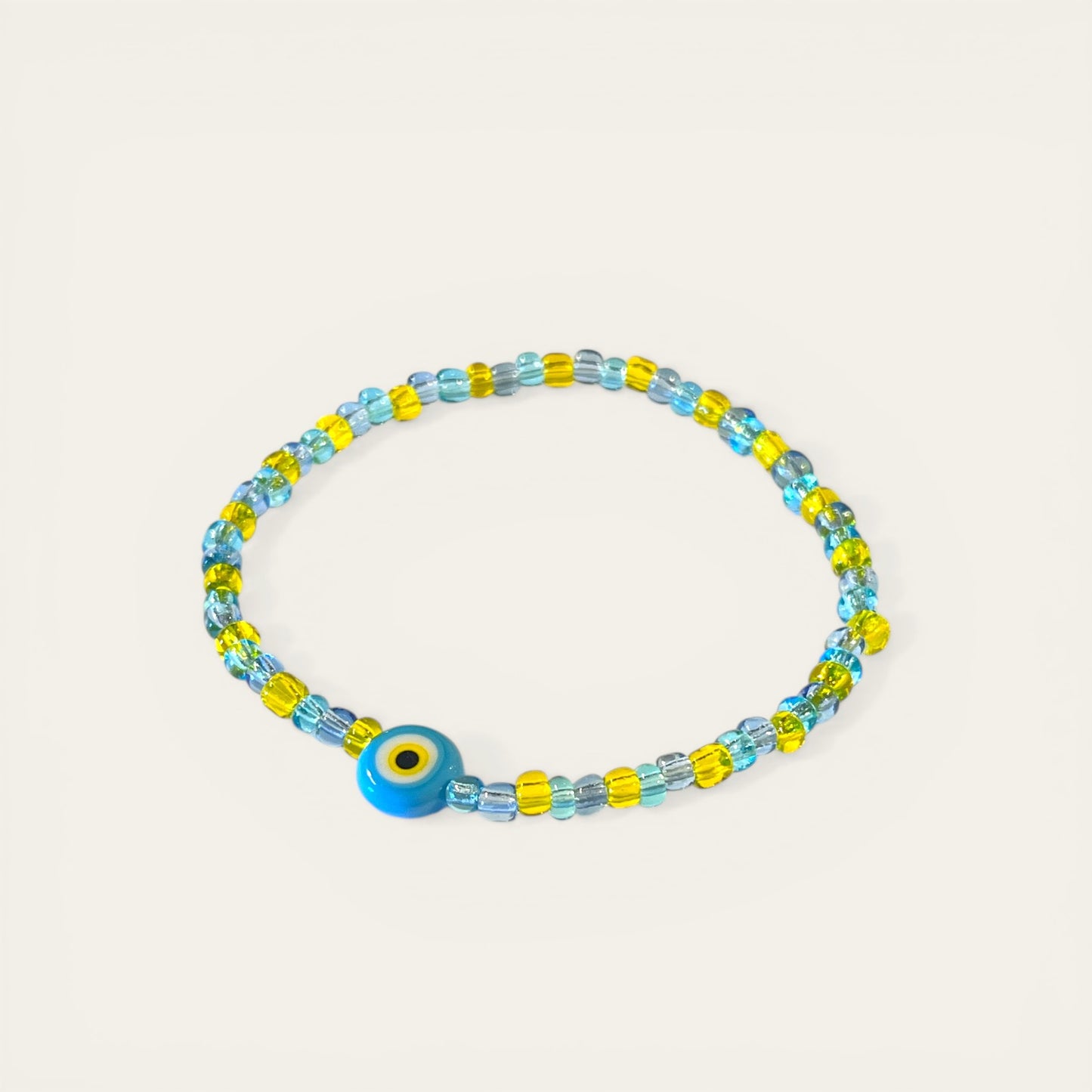 Armbånd i store glasperler - gul/blå